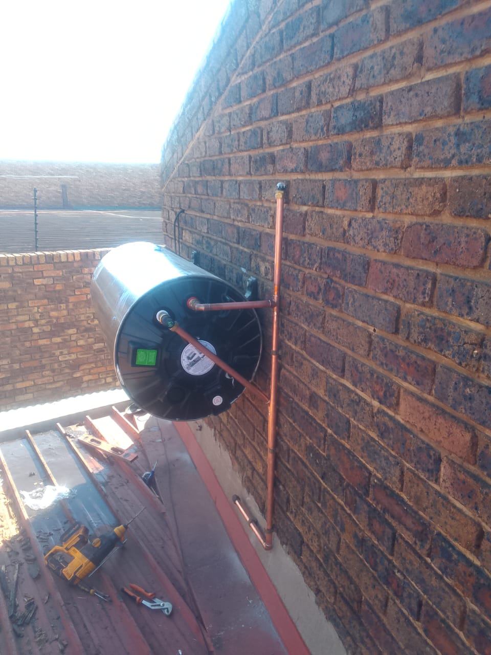 Centurion plumber carrying out geyser installation and replacement work