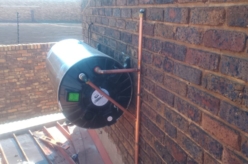 Electric geyser installation on a rooftop