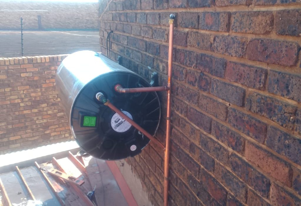 Electric geyser installation on a rooftop