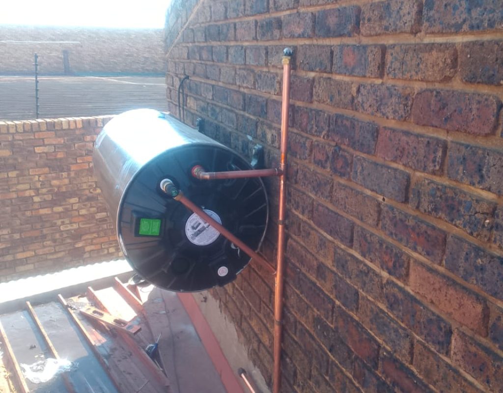 Electric geyser installation on a rooftop